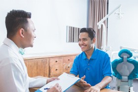patient talking to dentist about financing options    