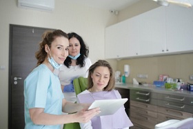 Woman at consultation with cosmetic dentist