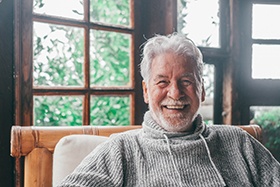 Closeup of senior man smiling at home