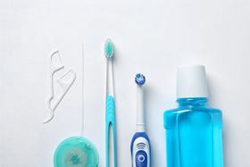 Oral hygiene products arranged in a straight line