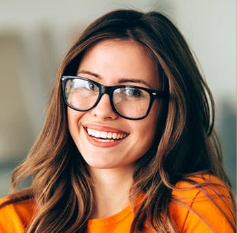 woman in glasses smiling