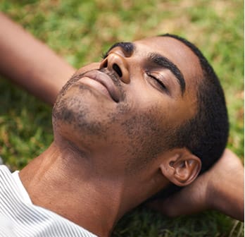 man laying in grass