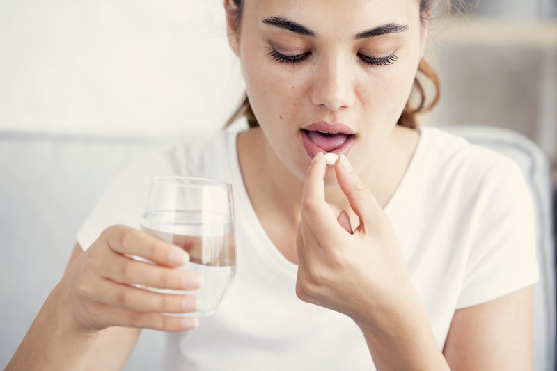 Woman taking sleeping pills to manage sleep apnea