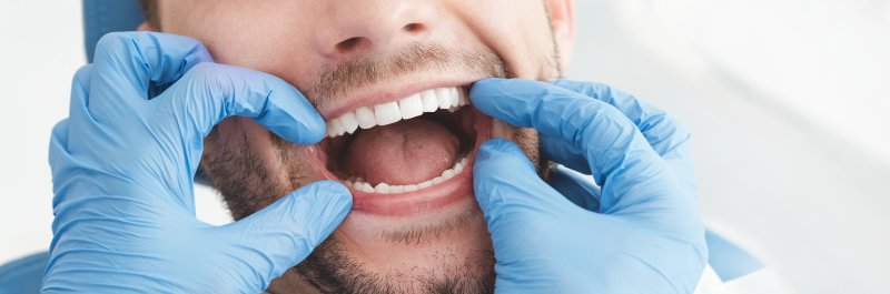 dentist checking small teeth in Dallas