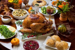 Table filled with Thanksgiving food and drinks